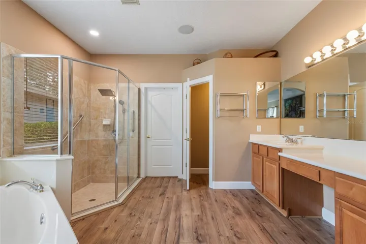 Primary En-Suite with Dual Sinks, Vanity, Garden Tub, Stand Alone Shower, Water Closet  and access to Wardrobe