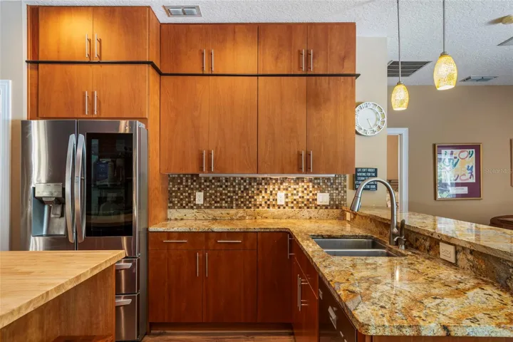 Gourmet Master Chef inspired kitchen - Stone Counters, Custom Cabinetry from ceiling to floor