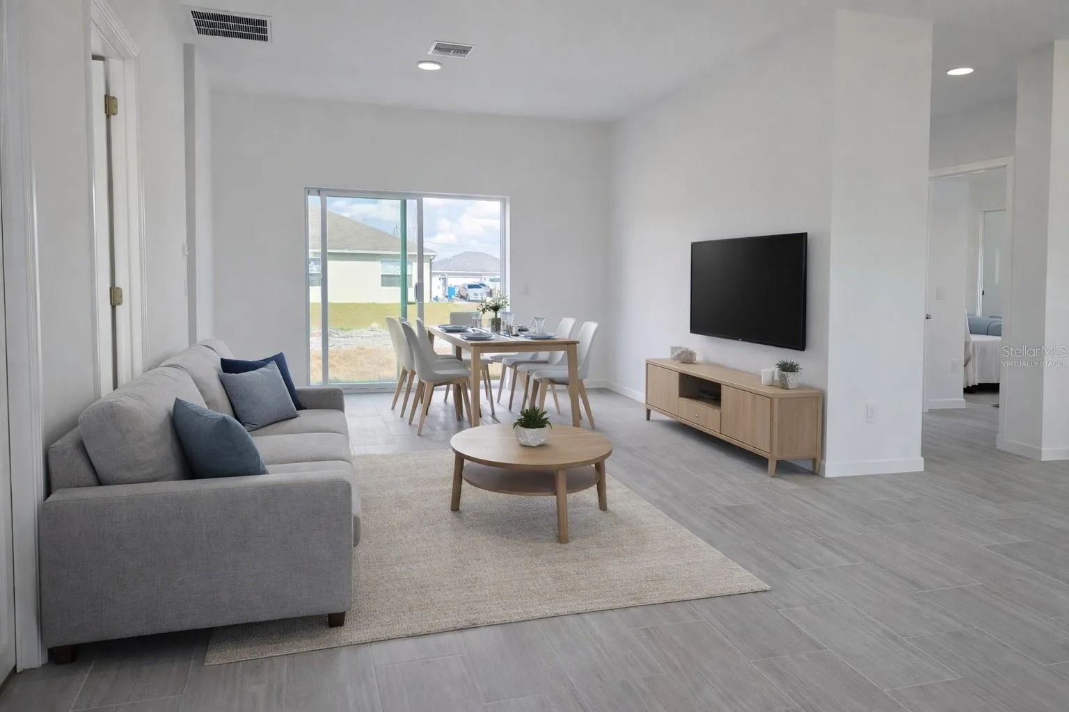 Virtually staged living and dining area