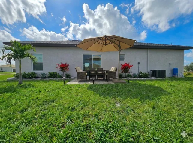 Covered rear patio and backyard
