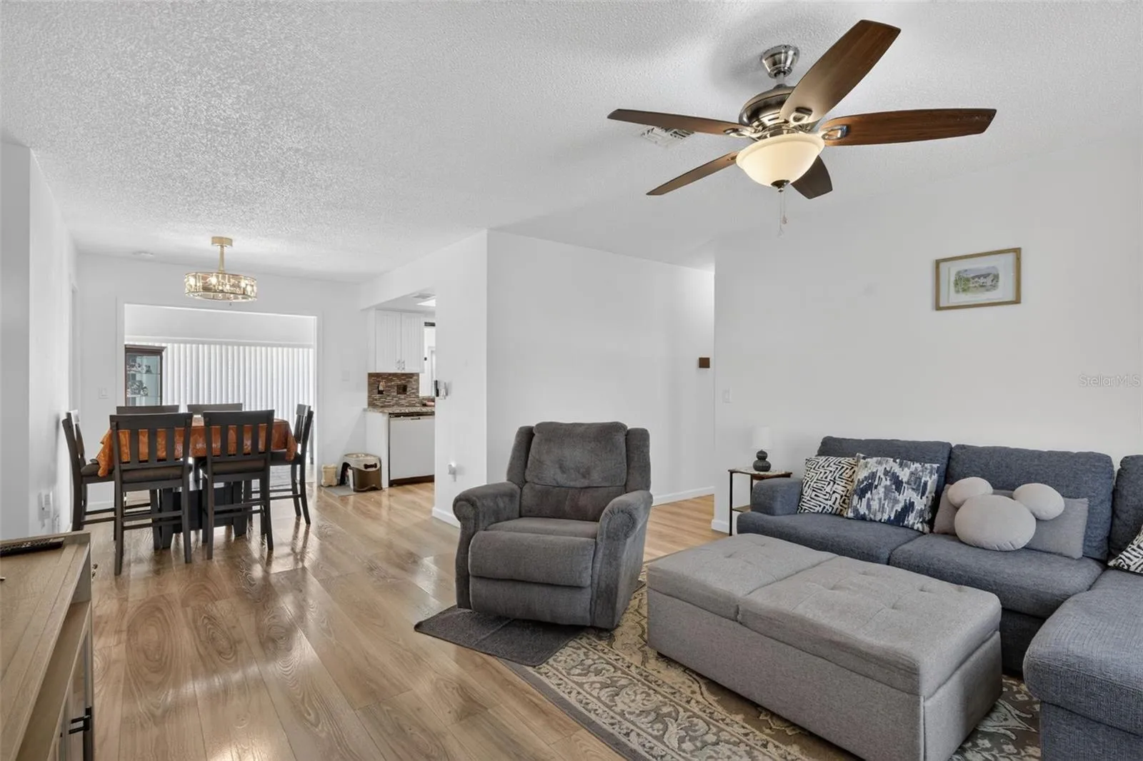 Living room as you walk in the front door with dining in the far left