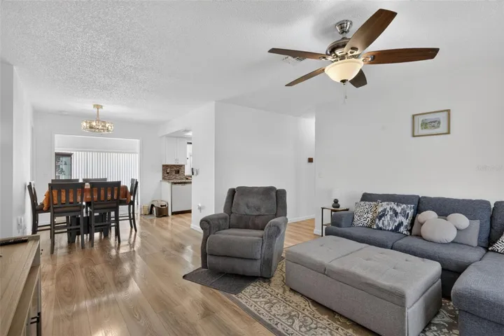 Living room as you walk in the front door with dining in the far left