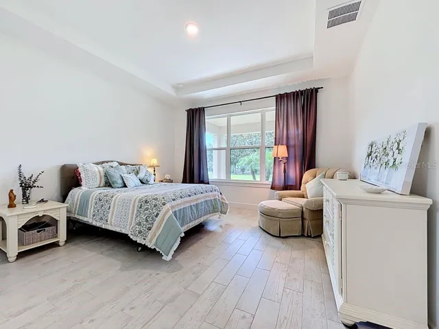 Primary Suite, w/Tray Ceiling and Large Window, and Tile Flooring