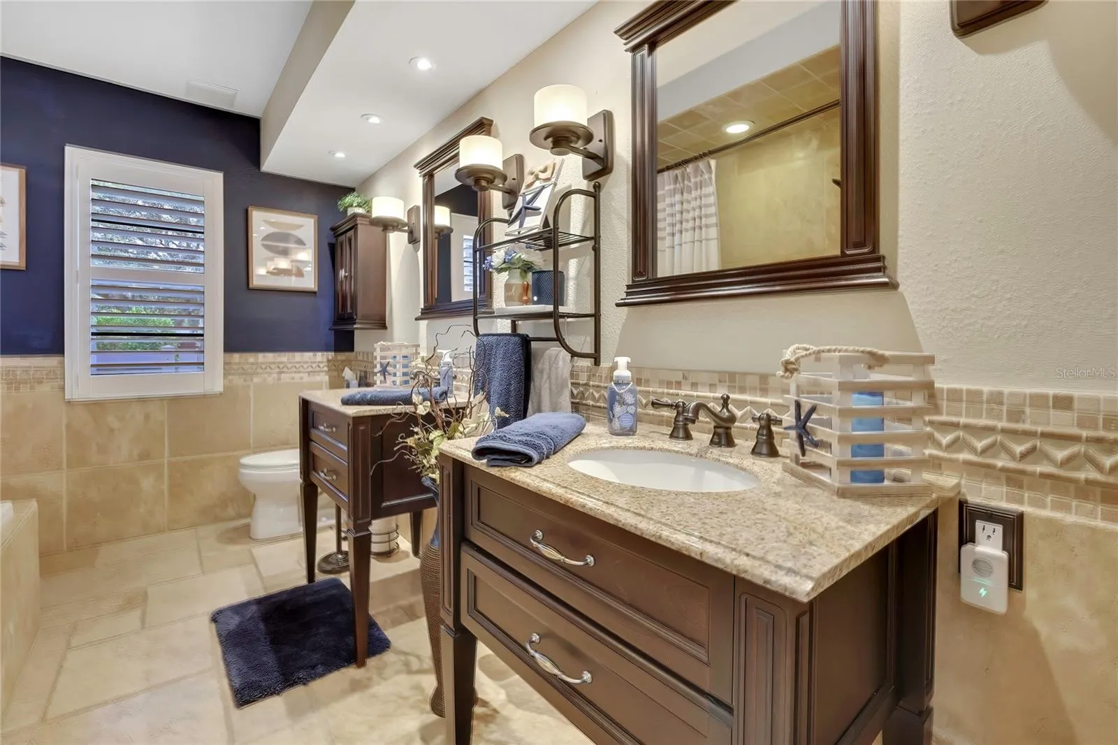 Main bath, dual sinks, tub/shower. Also, provides a pool bath entry door.