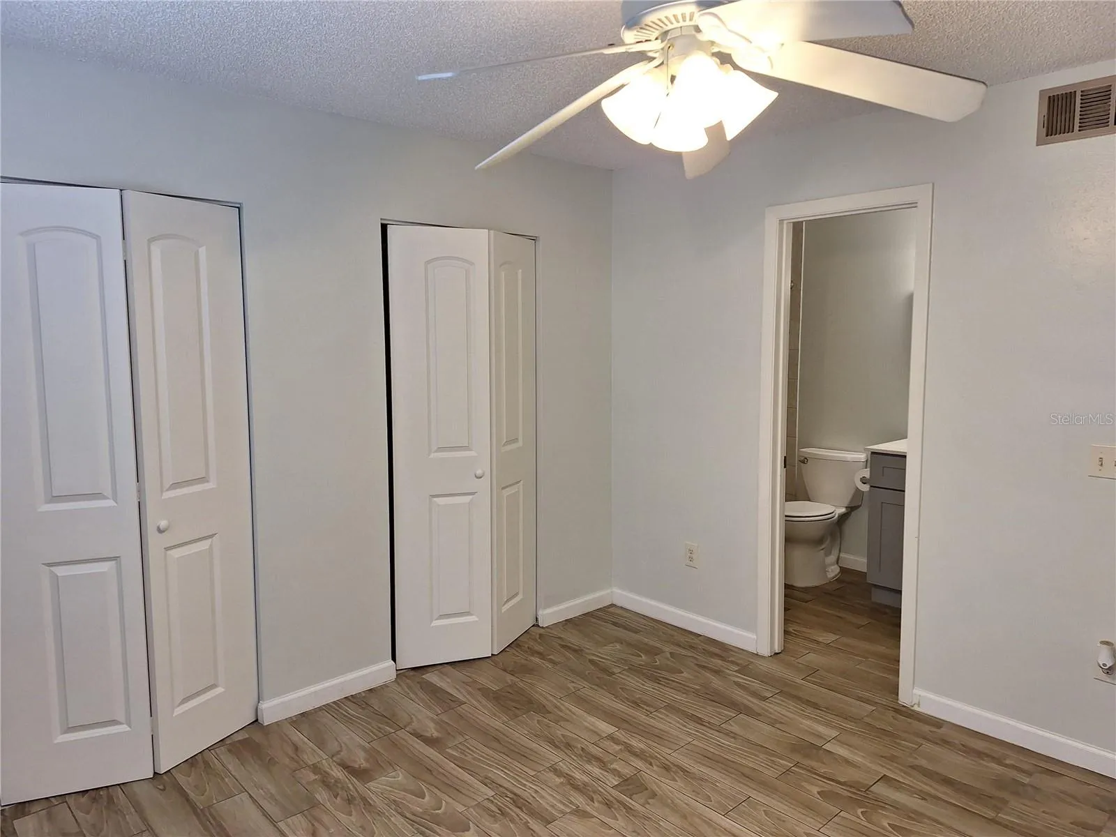 Master bedroom with view into the master bath.