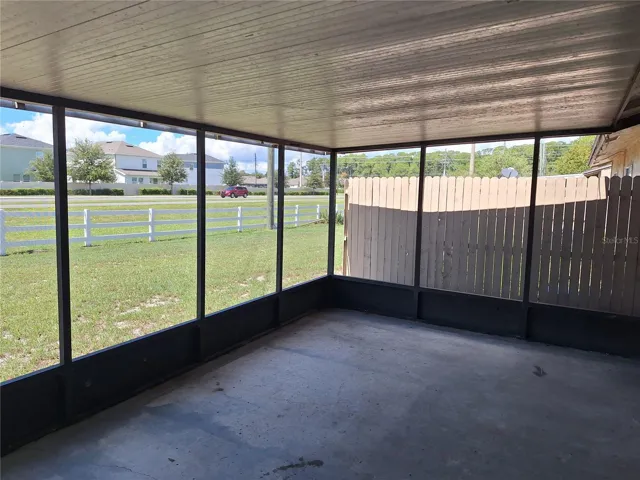 Covered and screened back porch.