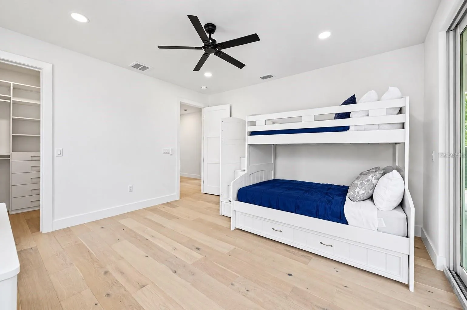 Guest bedroom, with access to the balcony that has the spiral staircase to the pool deck
