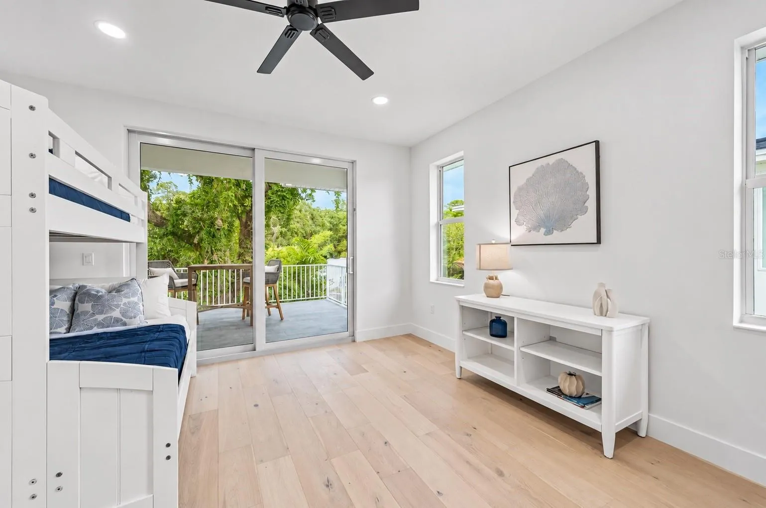 Guest bedroom, with access to the balcony that has the spiral staircase to the pool deck