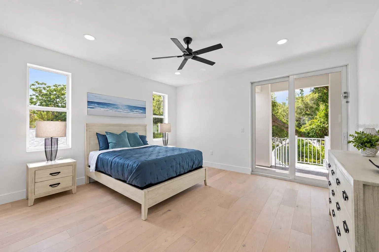 Guest bedroom, with access to the balcony that has the spiral staircase to the pool deck