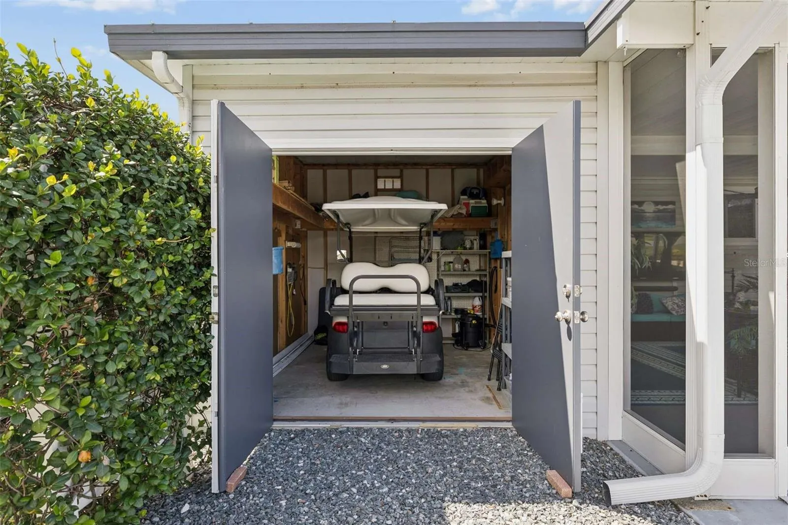 Garage for golf cart with garage door