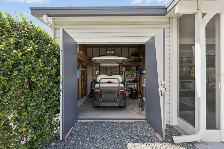 Garage for golf cart with garage door