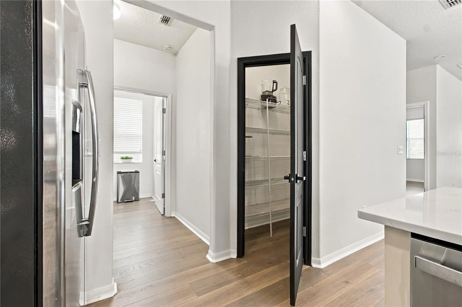 Kitchen Pantry to Laundry Room.