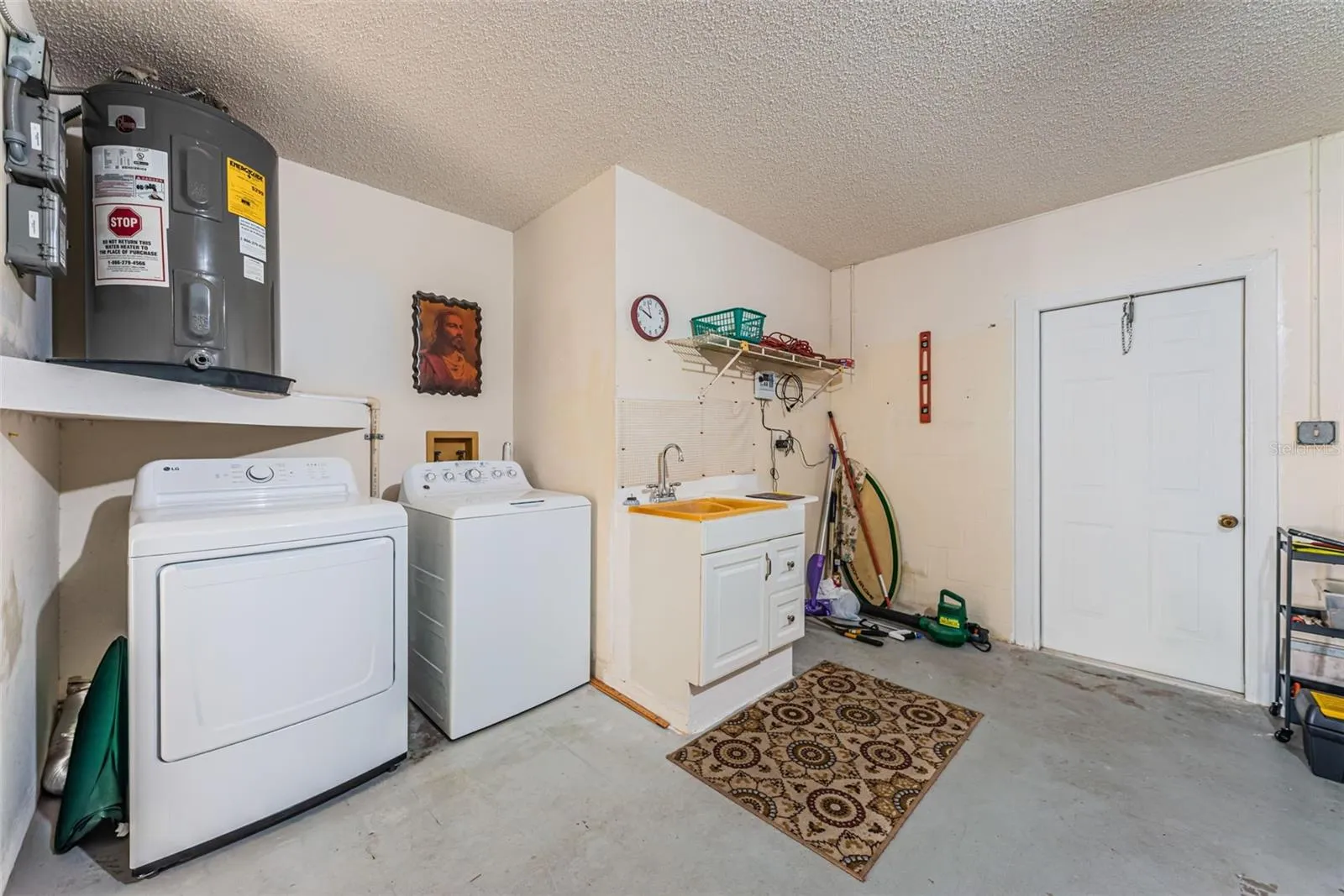 Laundry in Garage - Garage Service Door to Backyard