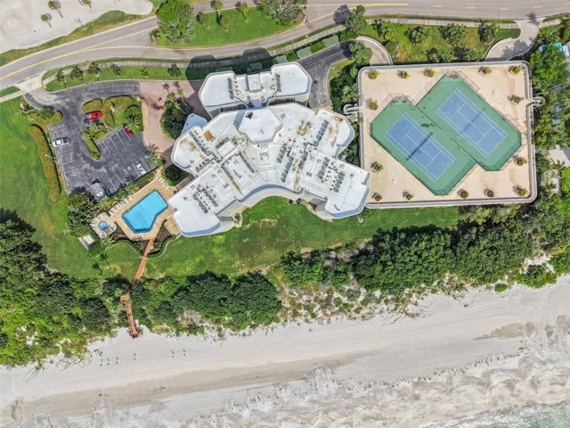 Pool and Spa with walkway to beach. Tennis Courts