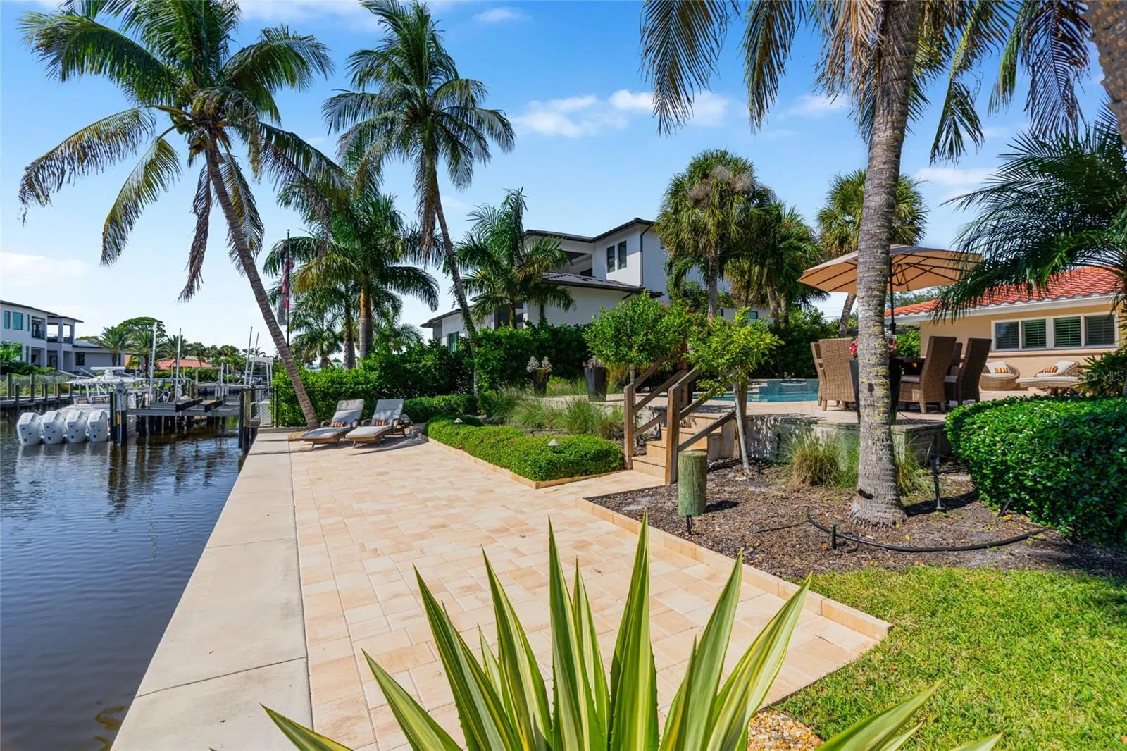 Canal Walkway View, highlighting the connection to the water and Siesta Key lifestyle.