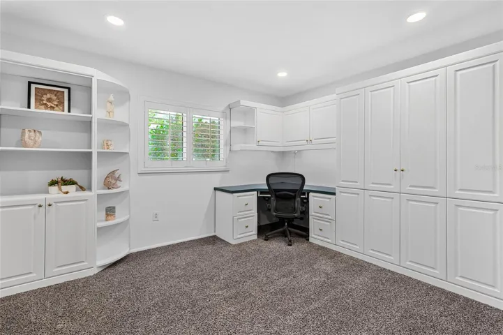 Bedroom 4 with Murphy Bed and Home Office Built Ins.