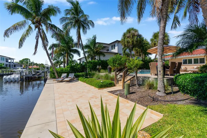 Canal Walkway View, highlighting the connection to the water and Siesta Key lifestyle.