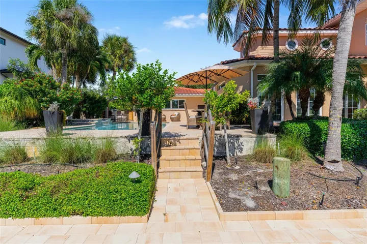 Paver Path To Waterfront, highlighting the connection to the water and Siesta Key lifestyle.