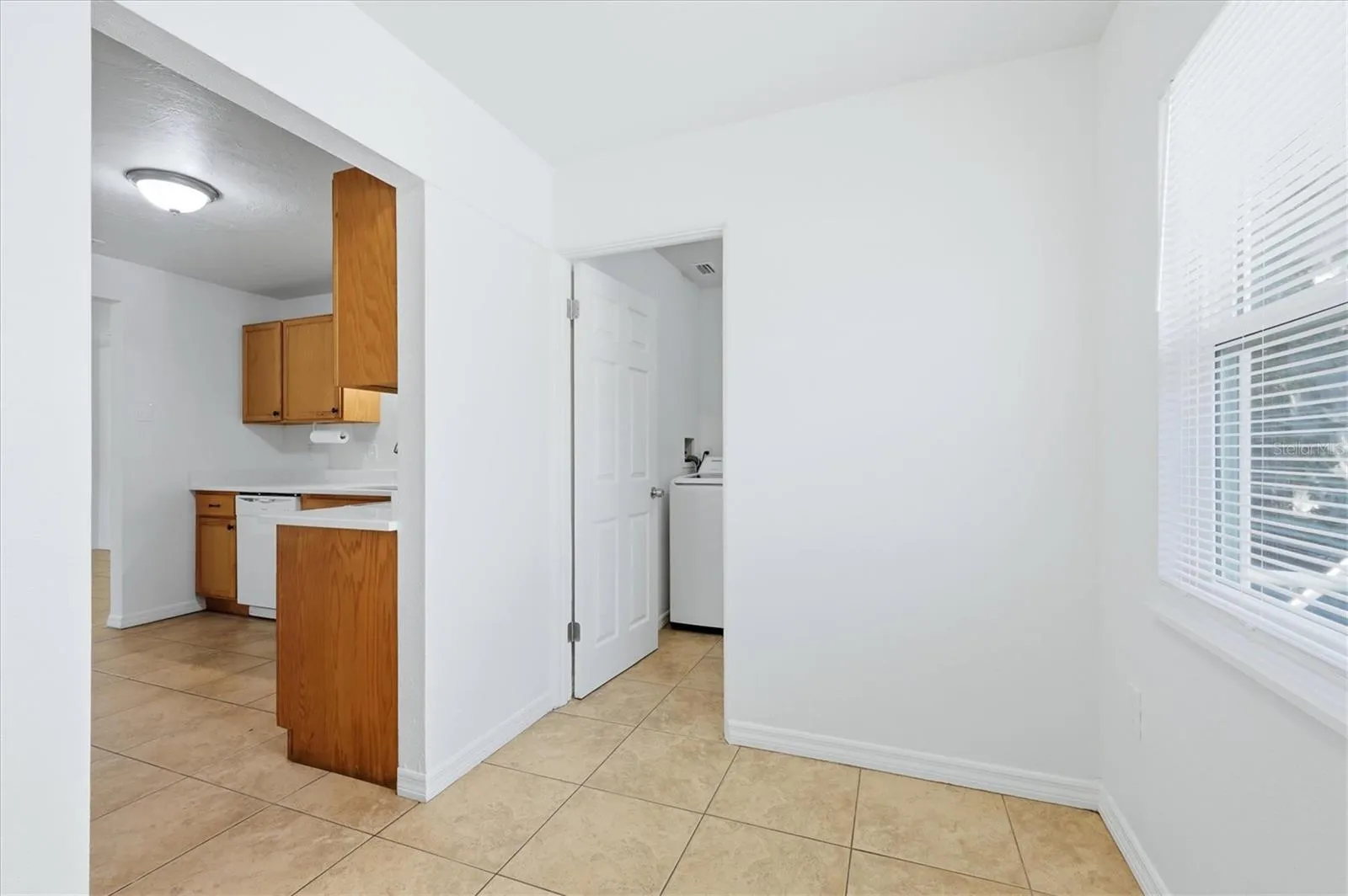 Breakfast nook opens to kitchen and laundry room.