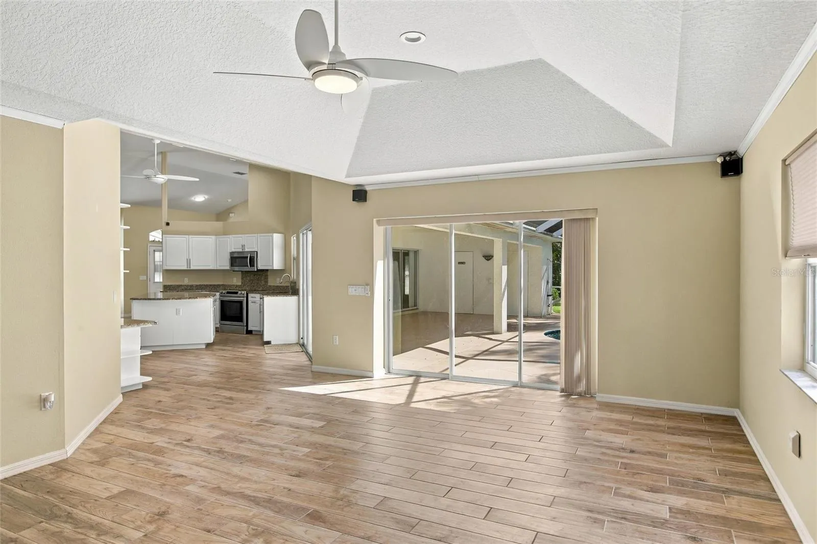 Family Room View of Kitchen and Pocket Slider to Lanai