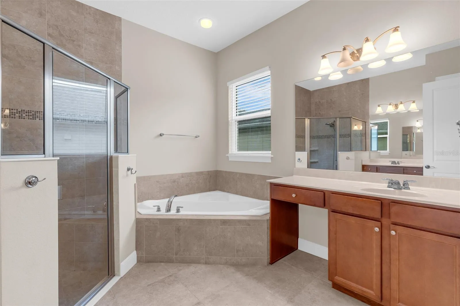 PRIMARY BATHROOM. DUAL SINKS, SOAKING TUB + WALK IN SHOWER