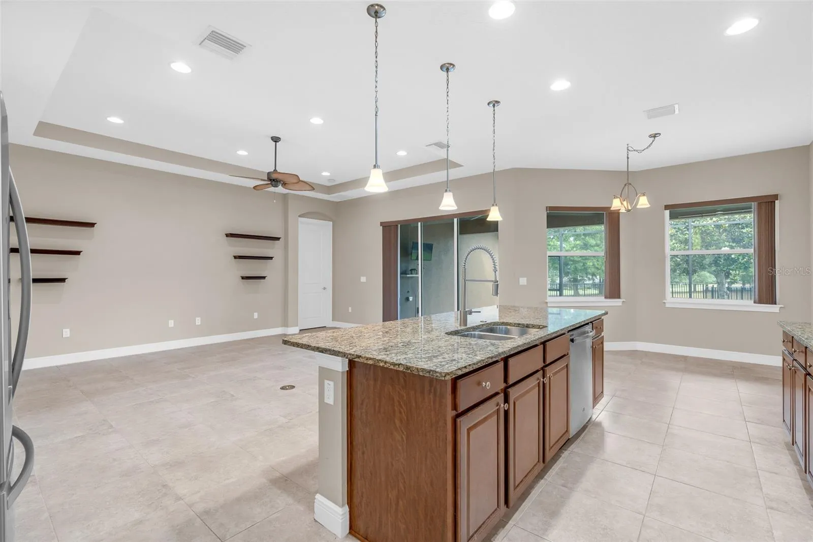 BUTLERS PANTRY WITH VIEWS OF LIVING / KITCHEN TO BACKYARD