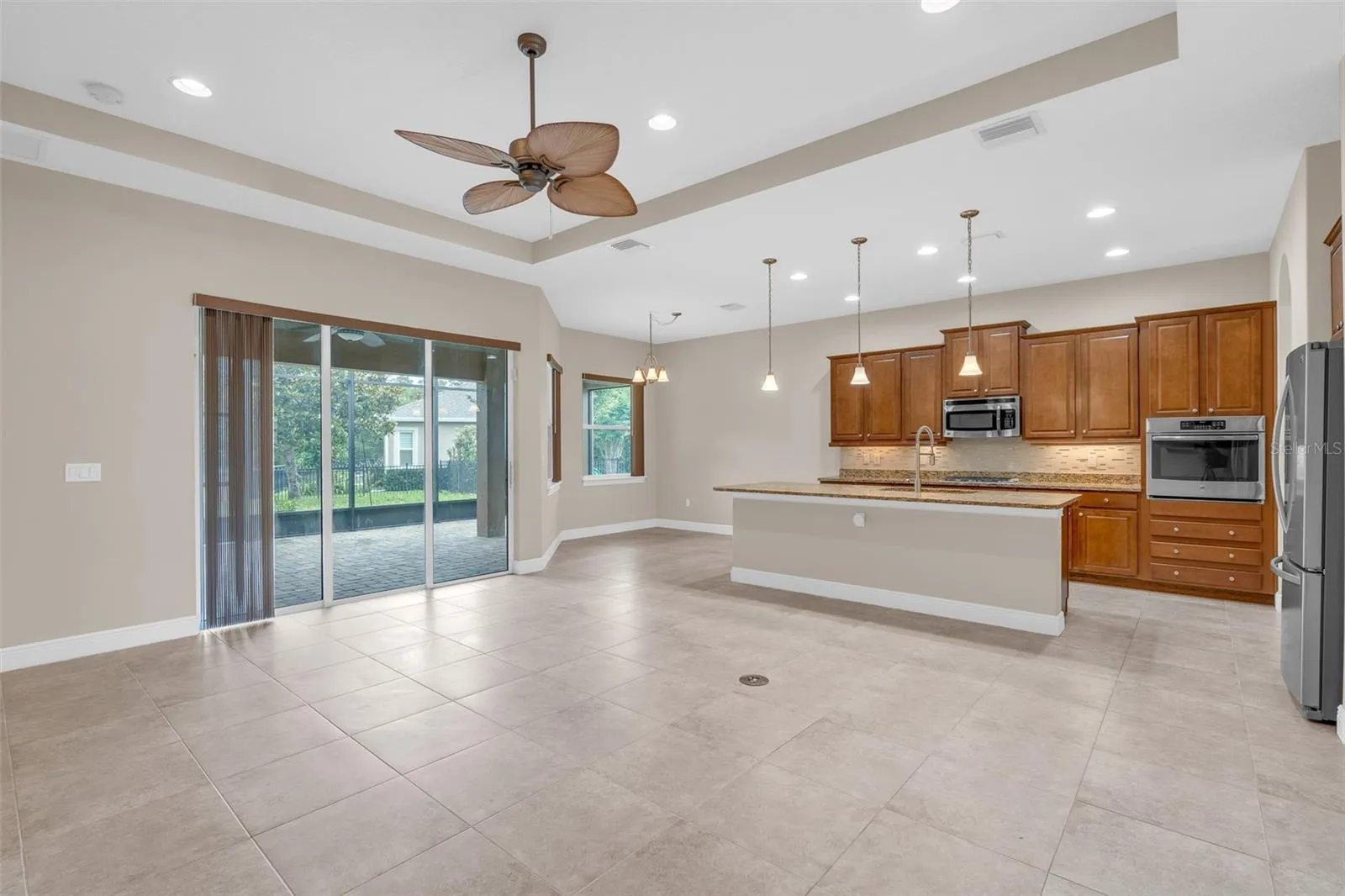 LIVING/DINING KITCHEN WITH SLIDERS TO SCREENED PATIO
