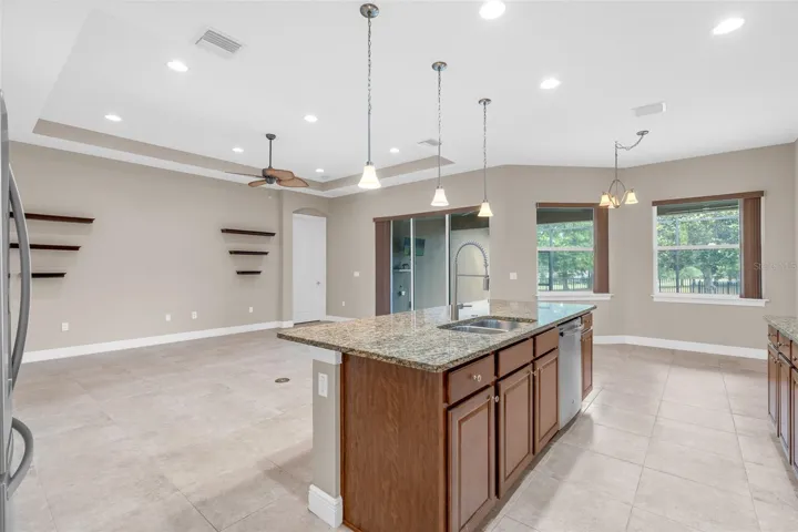 BUTLERS PANTRY WITH VIEWS OF LIVING / KITCHEN TO BACKYARD
