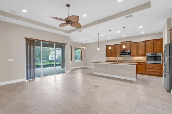 LIVING/DINING KITCHEN WITH SLIDERS TO SCREENED PATIO
