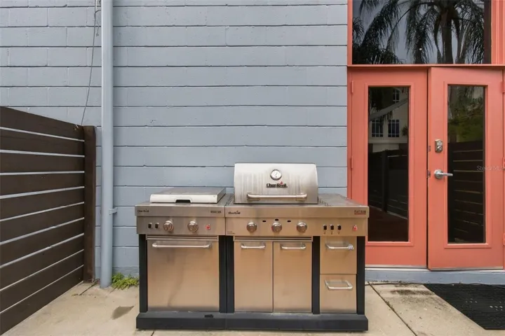 Outdoor grill remains on property, perfect for grilling and entertaining.