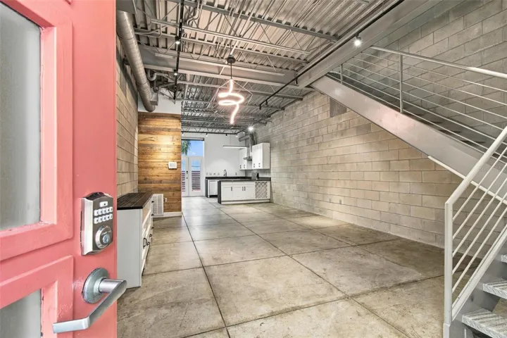 Industrial-chic open concept floor plan blending modern upgrades with raw architectural elements.