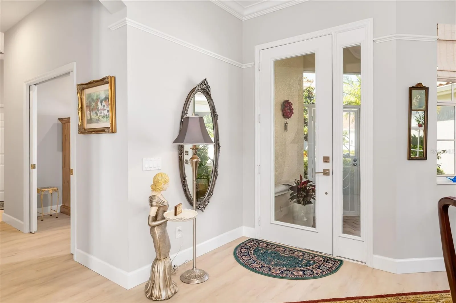 Beautiful doors with a view to the very spacious and newly installed screened front porch. Added privacy also.