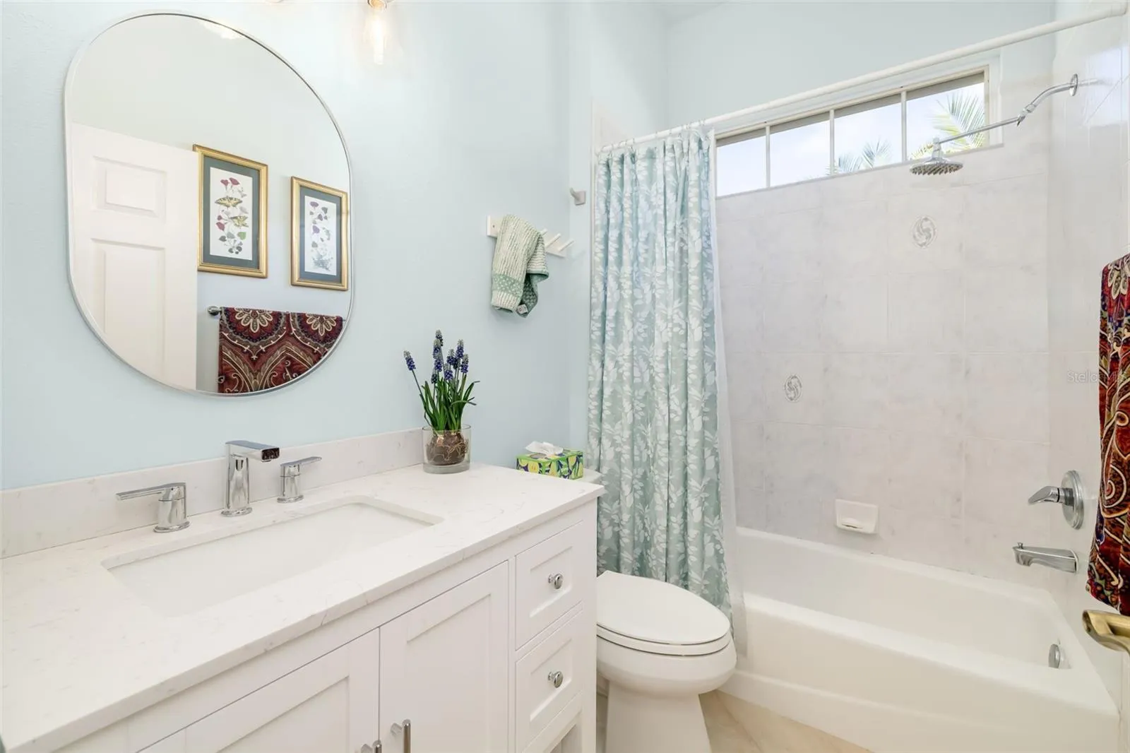 Second/Guest Bathroom. Newer Vanity and tiled tub surround. So pretty!
