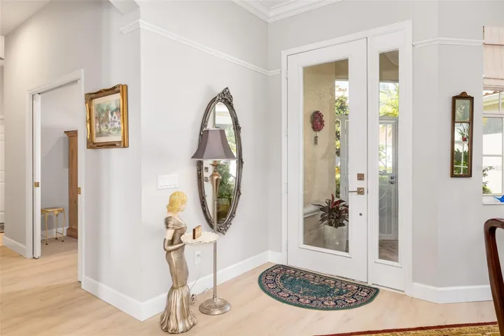 Beautiful doors with a view to the very spacious and newly installed screened front porch. Added privacy also.