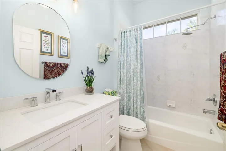 Second/Guest Bathroom. Newer Vanity and tiled tub surround. So pretty!