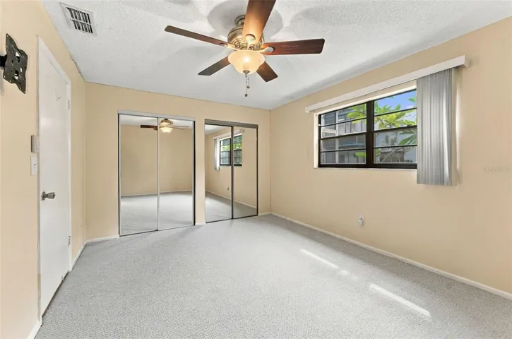 Primary bedroom at the back of the condo