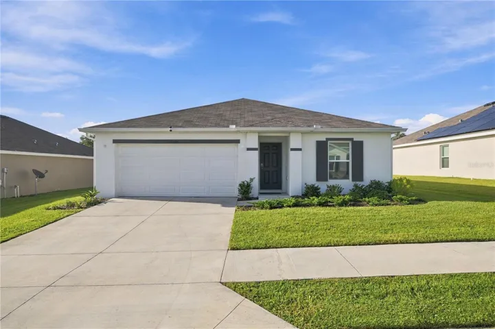 FRONT OF HOUSE SHOWING DRIVEWAY