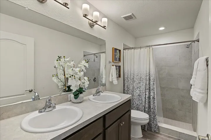 Primary Bath w/double sink, tile shower