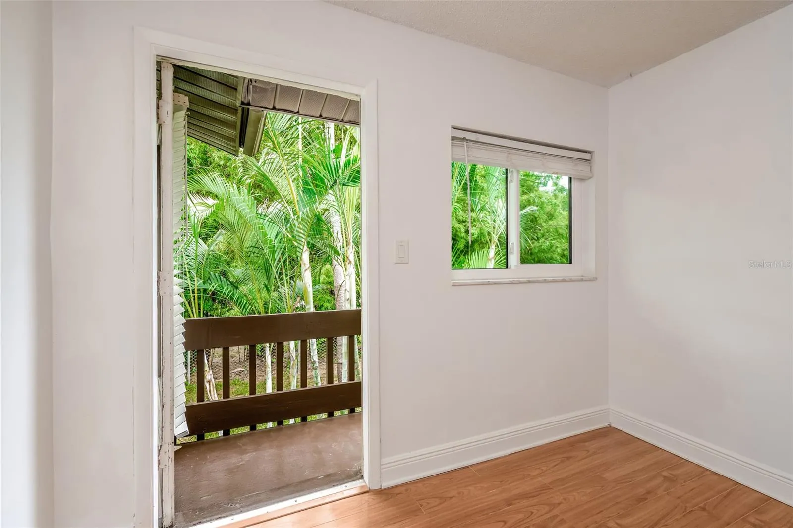 501 E Bay Dr 702, primary bedroom, doorway to balcony