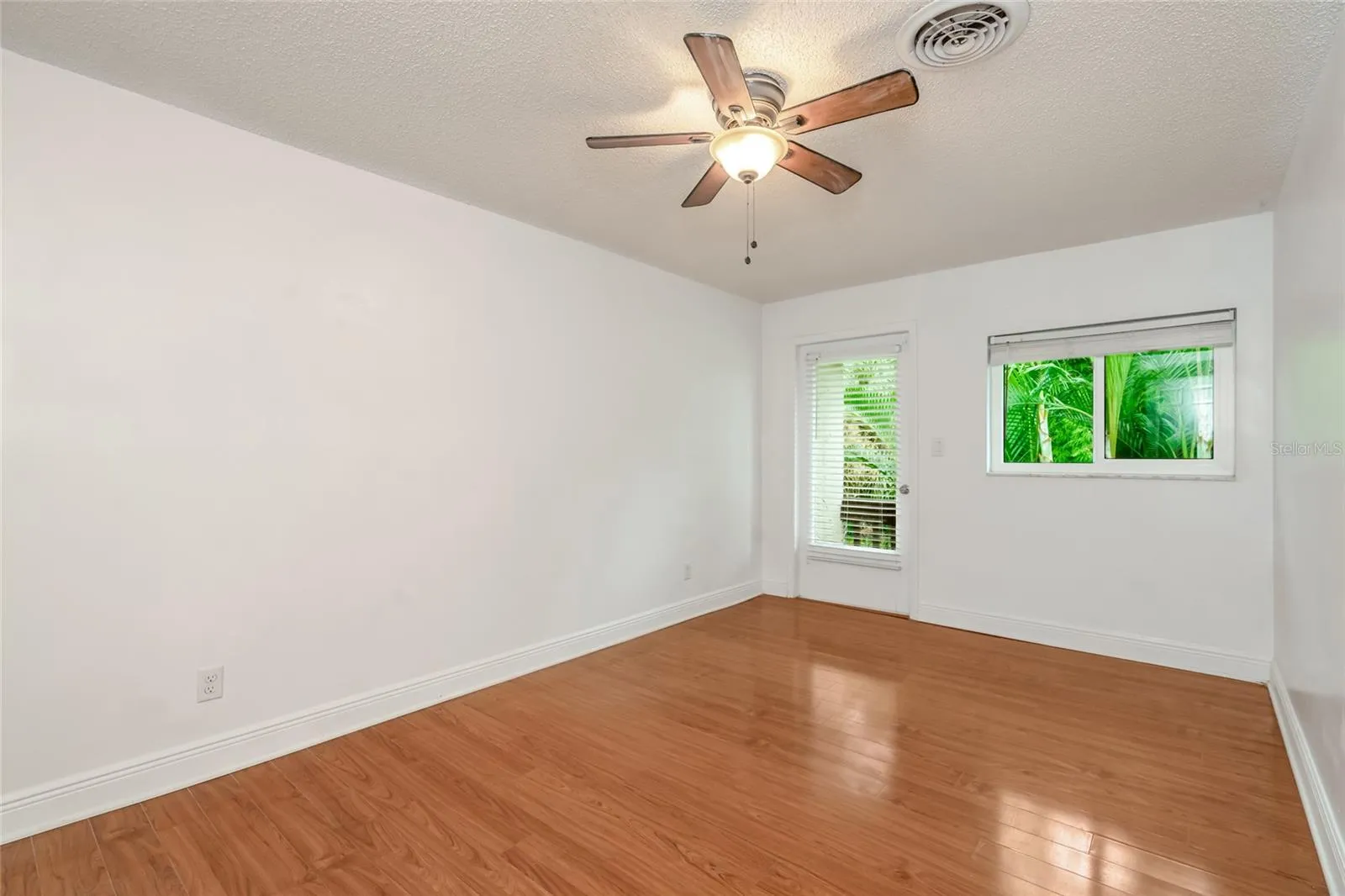 501 E Bay Dr 702, Primary bedroom, view toward back and doorway to balcony