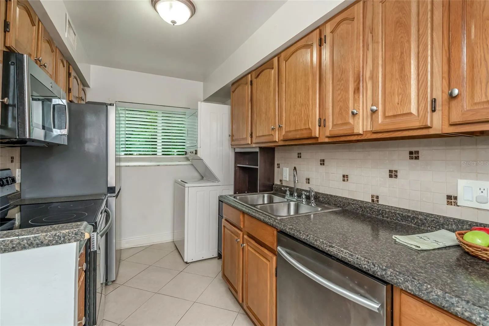 501 E Bay Dr 702, kitchen with view toward washer and dryer and back window