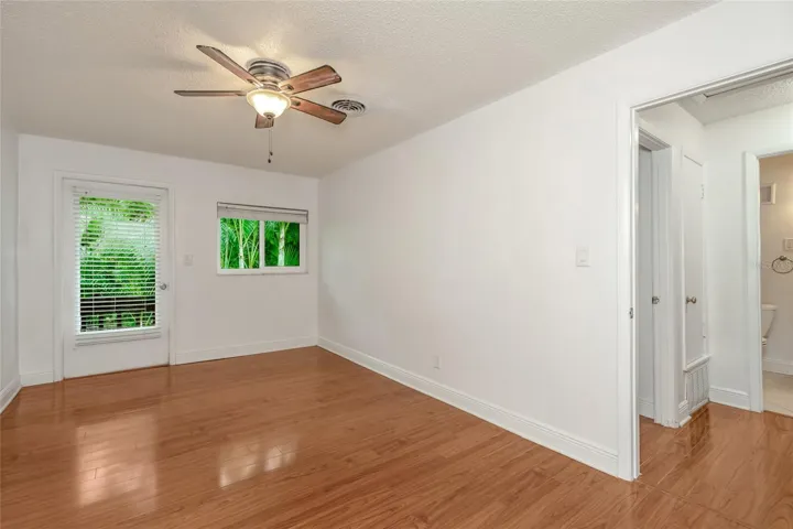 501 E Bay Dr 702, primary bedroom view toward back, door to balcony