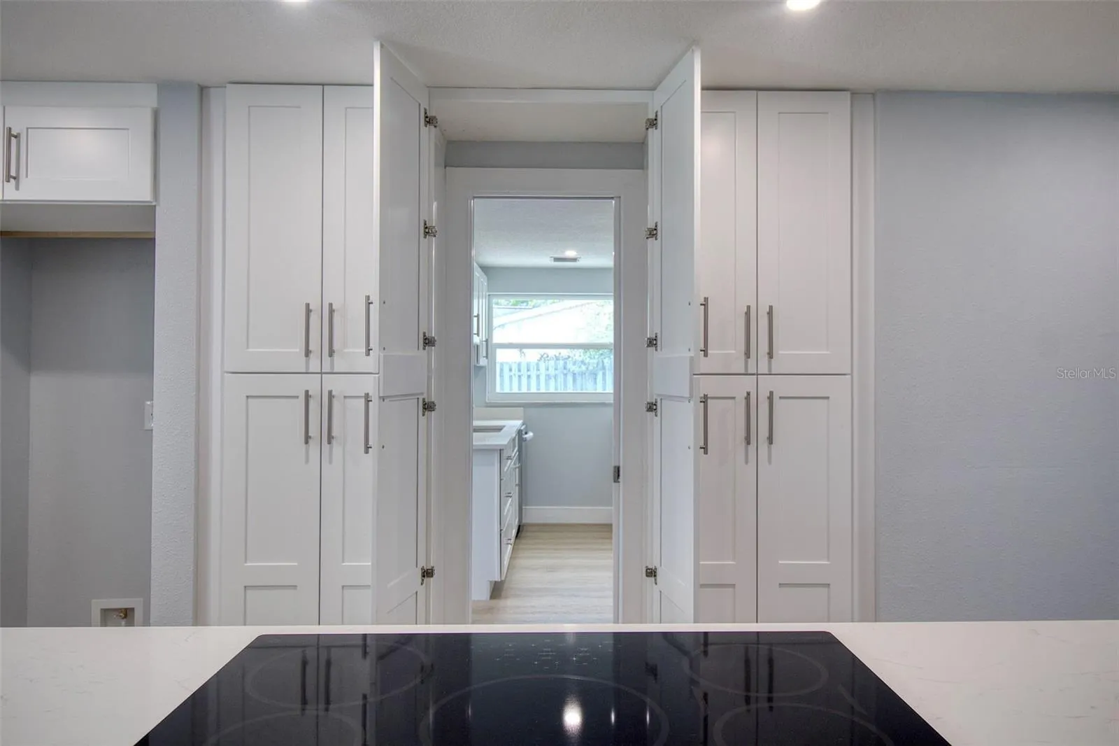 Hidden entrance to in-law suite from kitchen