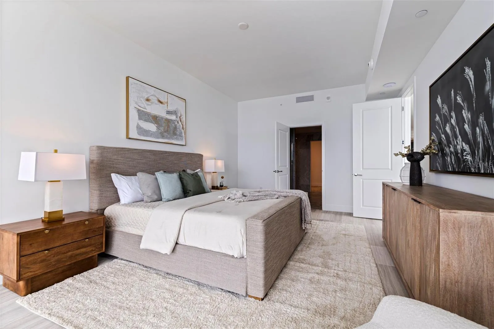The primary suite balances quiet luxury with effortless connection to the view.