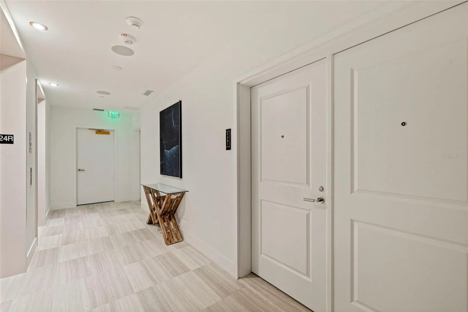 The private 24th-floor landing creates an arrival that feels discreet and distinctly residential.