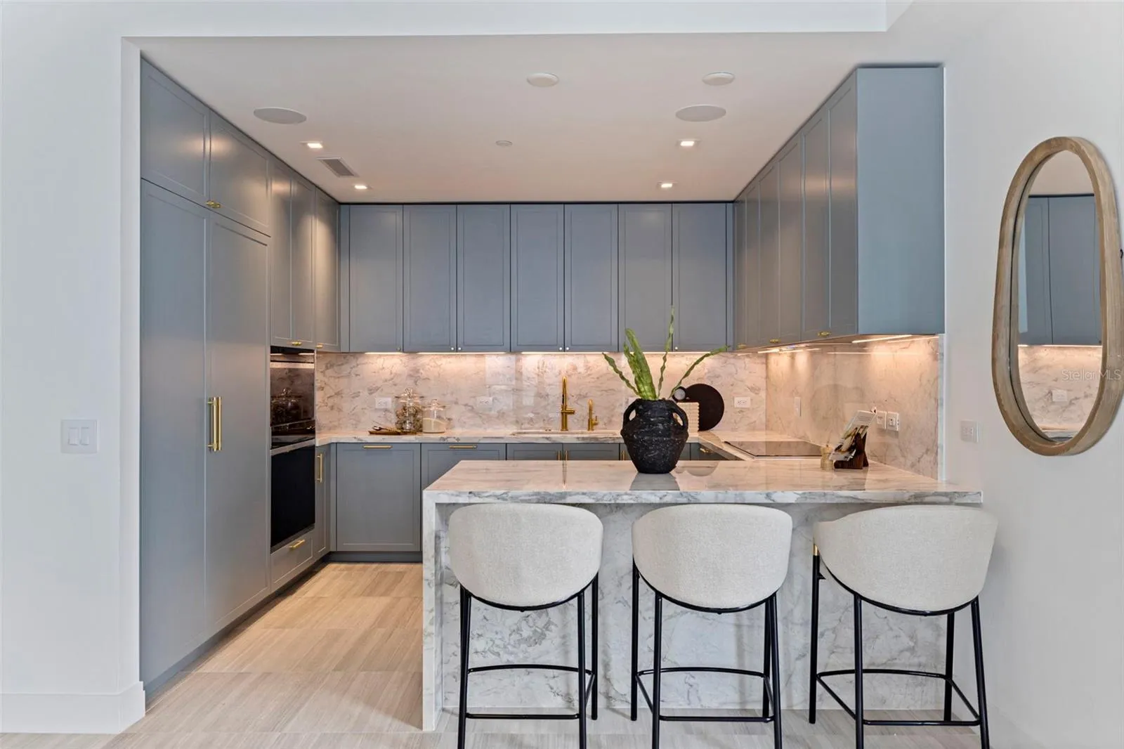 The signature Ritz-Carlton blue kitchen, finished with marble and bespoke detail.