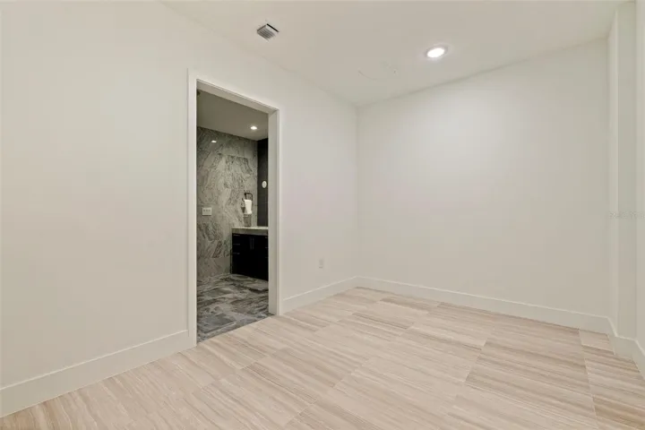 An expansive primary walk-in closet awaiting customization,