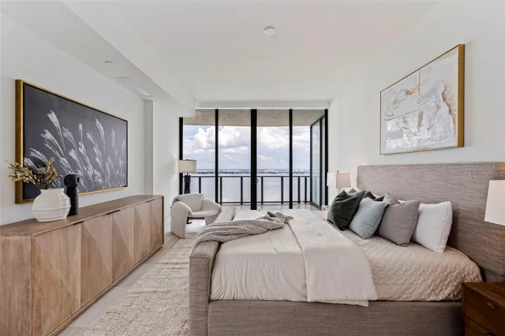 Wake above the water, where floor-to-ceiling glass frames the morning light.