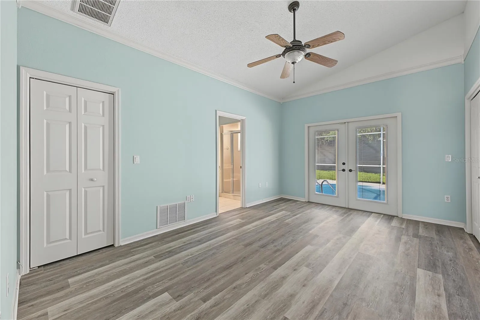 Primary bedroom with His &amp; Hers closets