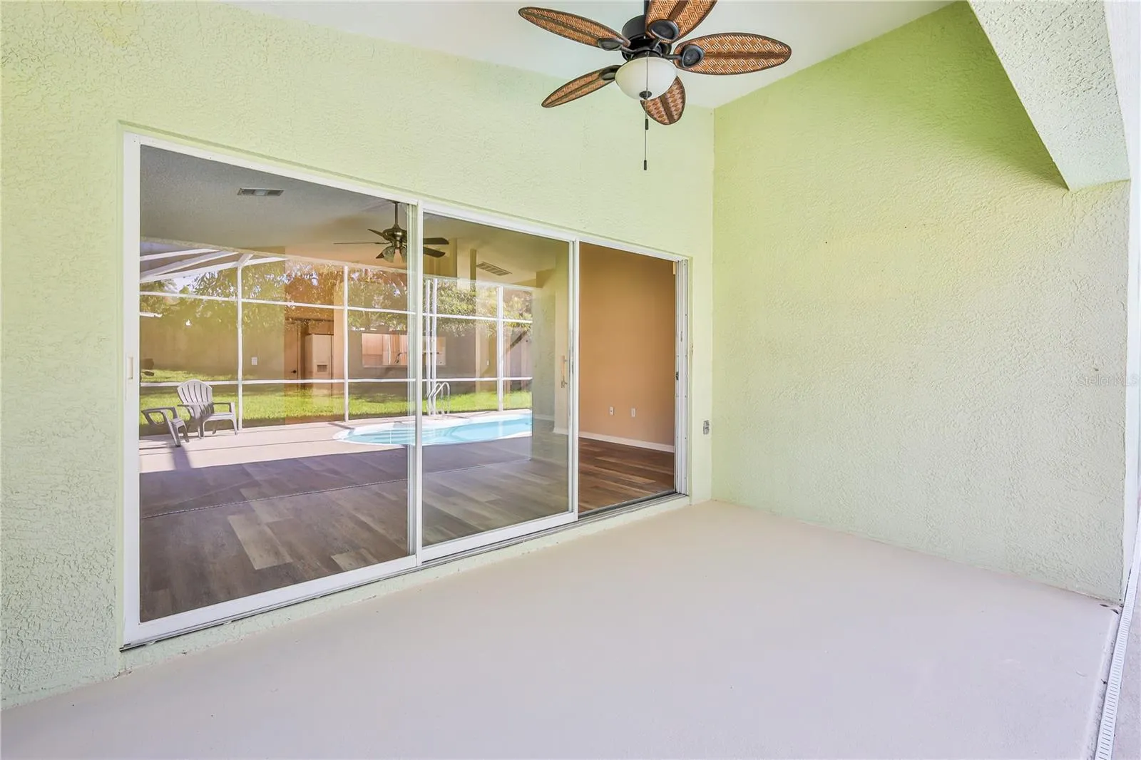 Covered lanai screened with child/pet safety barrier